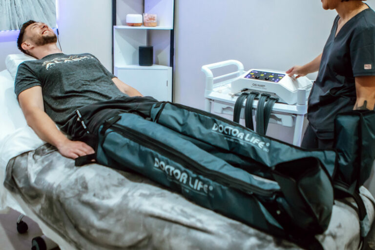 Man receiving pressotherapy compressions on his legs.