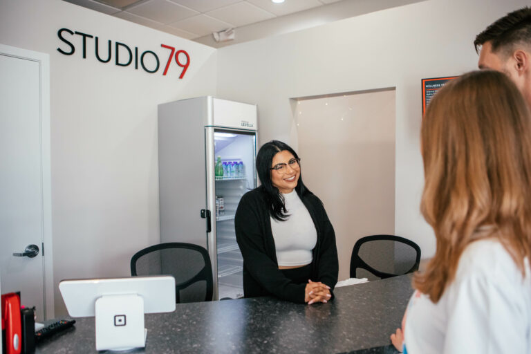 Spa Receptionist checking in new customers at the front desk