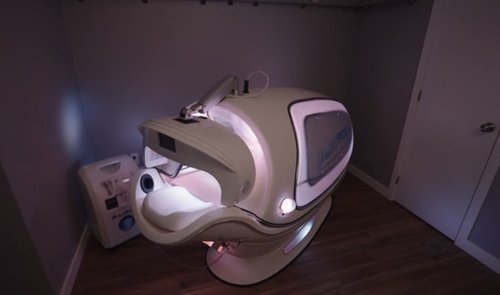 Infrared Sauna Pod glowing with lights