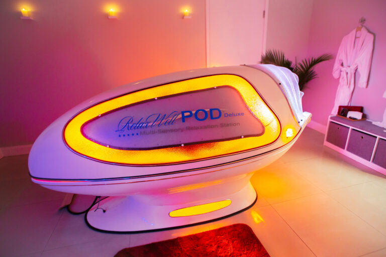 Infrared Sauna pod lit up with orange glow